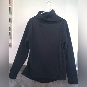 Athleta Black turtleneck sweater with zip pockets.